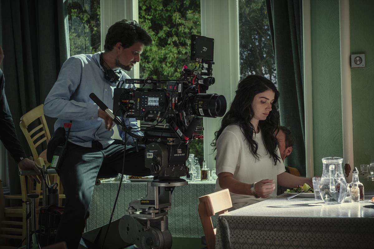 Cinematographer Felix Wiedemann and Eve Hewson on the set of “Behind Her Eyes.” Cr: Mark Mainz/Netflix