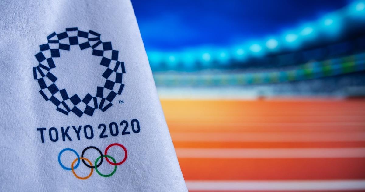 Tokyo 2020 Olympic logo, Athletics stadium in background. Cr: Tech Radar