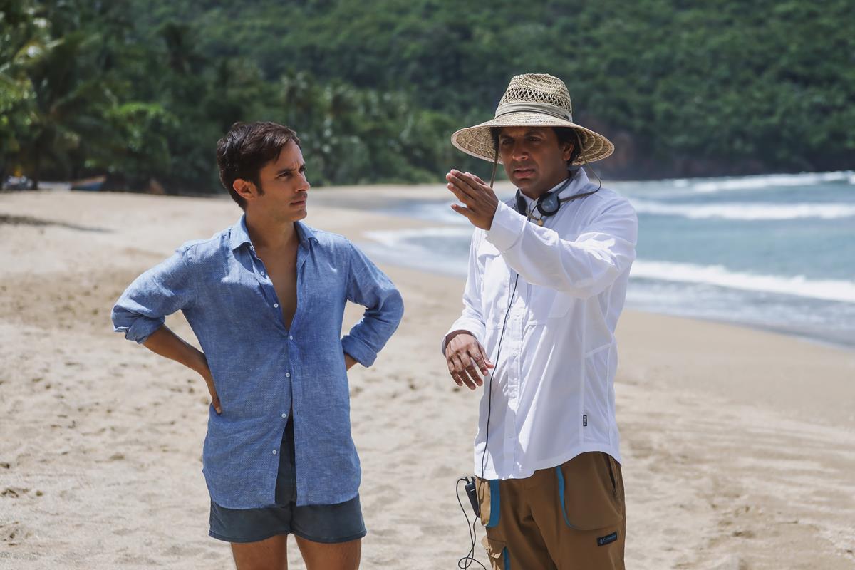 Gael García Bernal and filmmaker M. Night Shyamalan on the set of “Old.” Cr: Universal Pictures