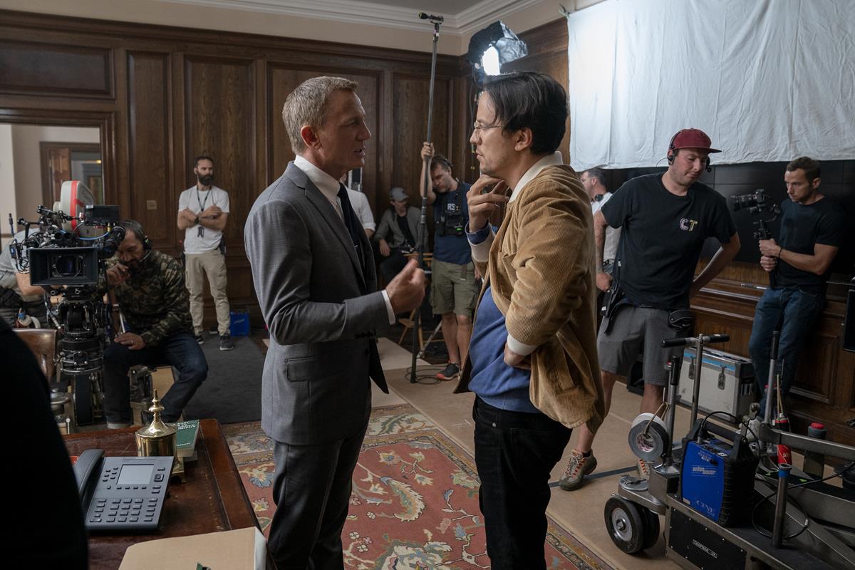 Daniel Craig and director Cary Joji Fukunaga on the set of “No Time To Die.” Cr: MGM