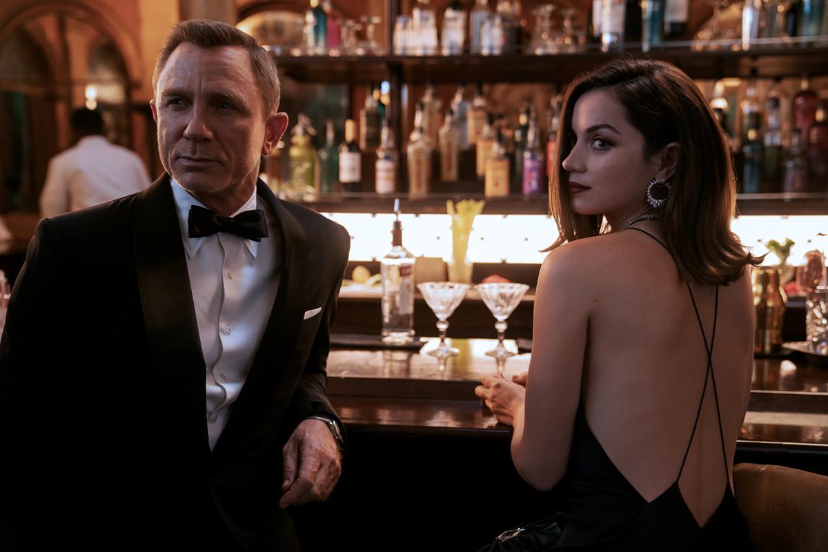 Daniel Craig as James Bond and Ana de Armas as Paloma in “No Time To Die.” Cr: MGM