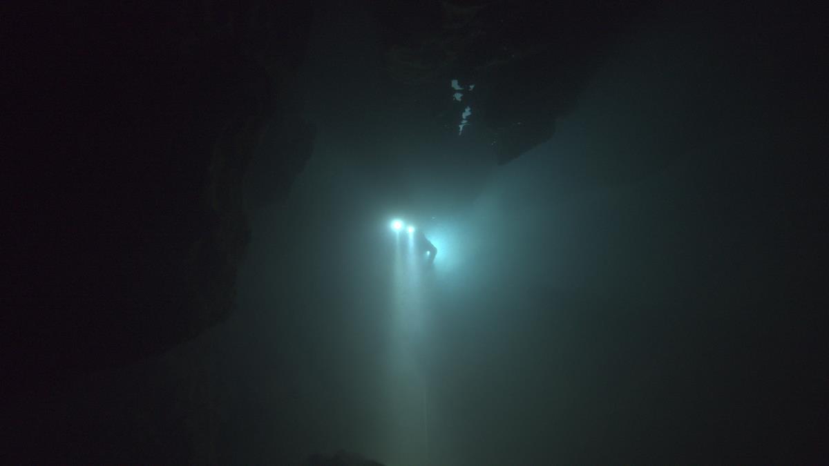 A diver floats through an underwater cave in “The Rescue.” Cr: National Geographic