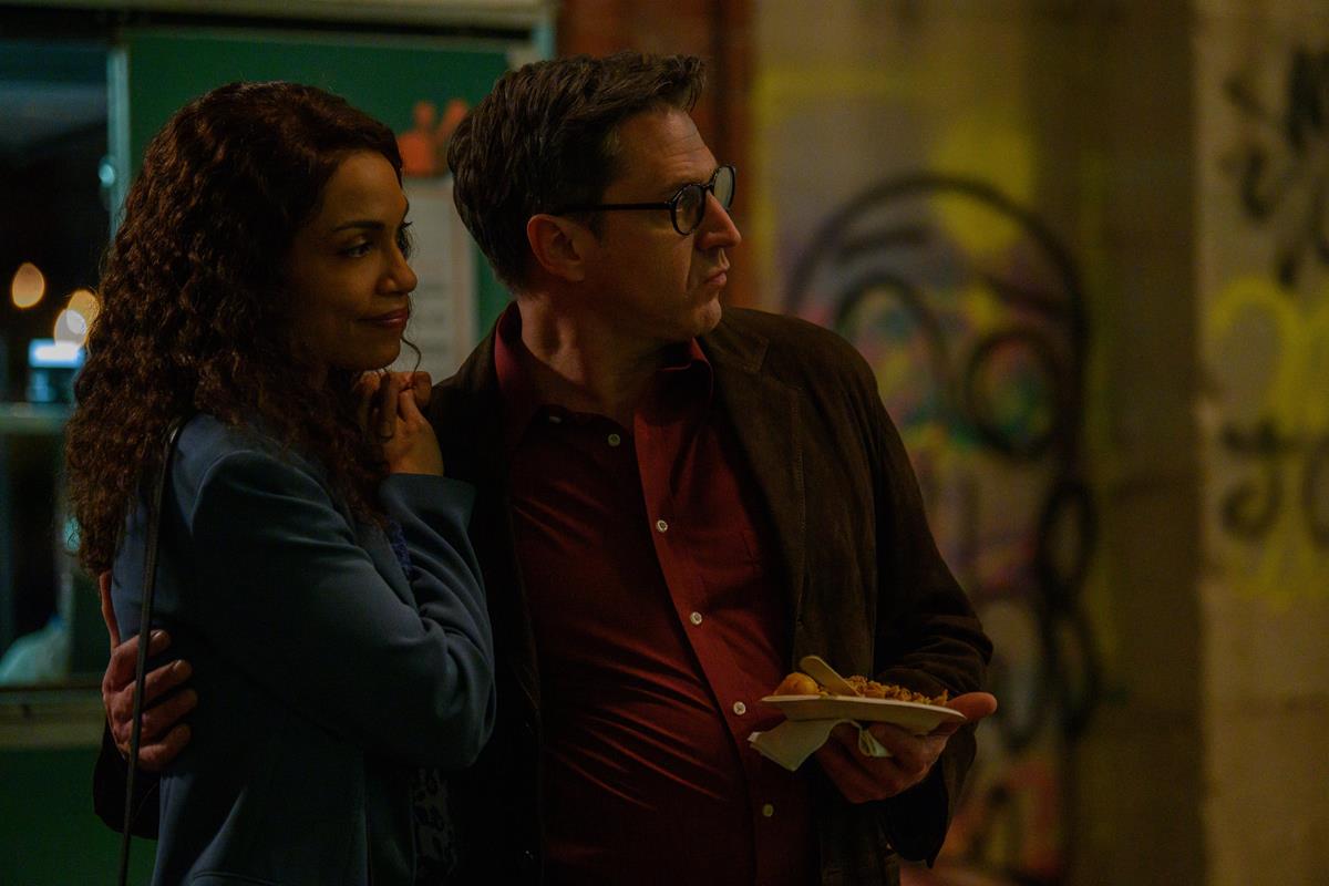 Rosario Dawson as Bridget Meyer and Raul Esparza as Paul Mendelson in episode 3 of “Dopesick.” Cr: Hulu