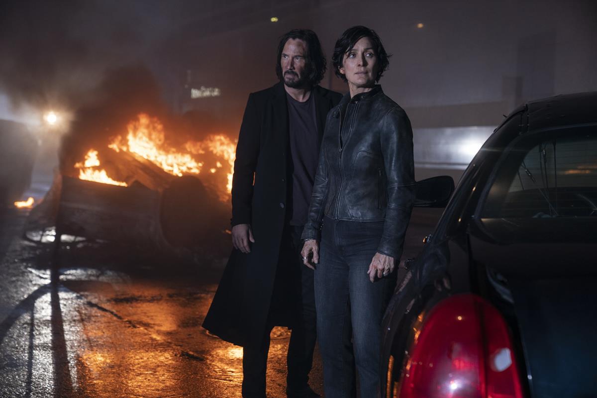 Keanu Reeves as Neo/Thomas Anderson and Carrie-Anne Moss as Trinity in director Lana Wachowski’s “The Matrix Resurrections.” Cr: Murray Close/ Warner Bros. Pictures