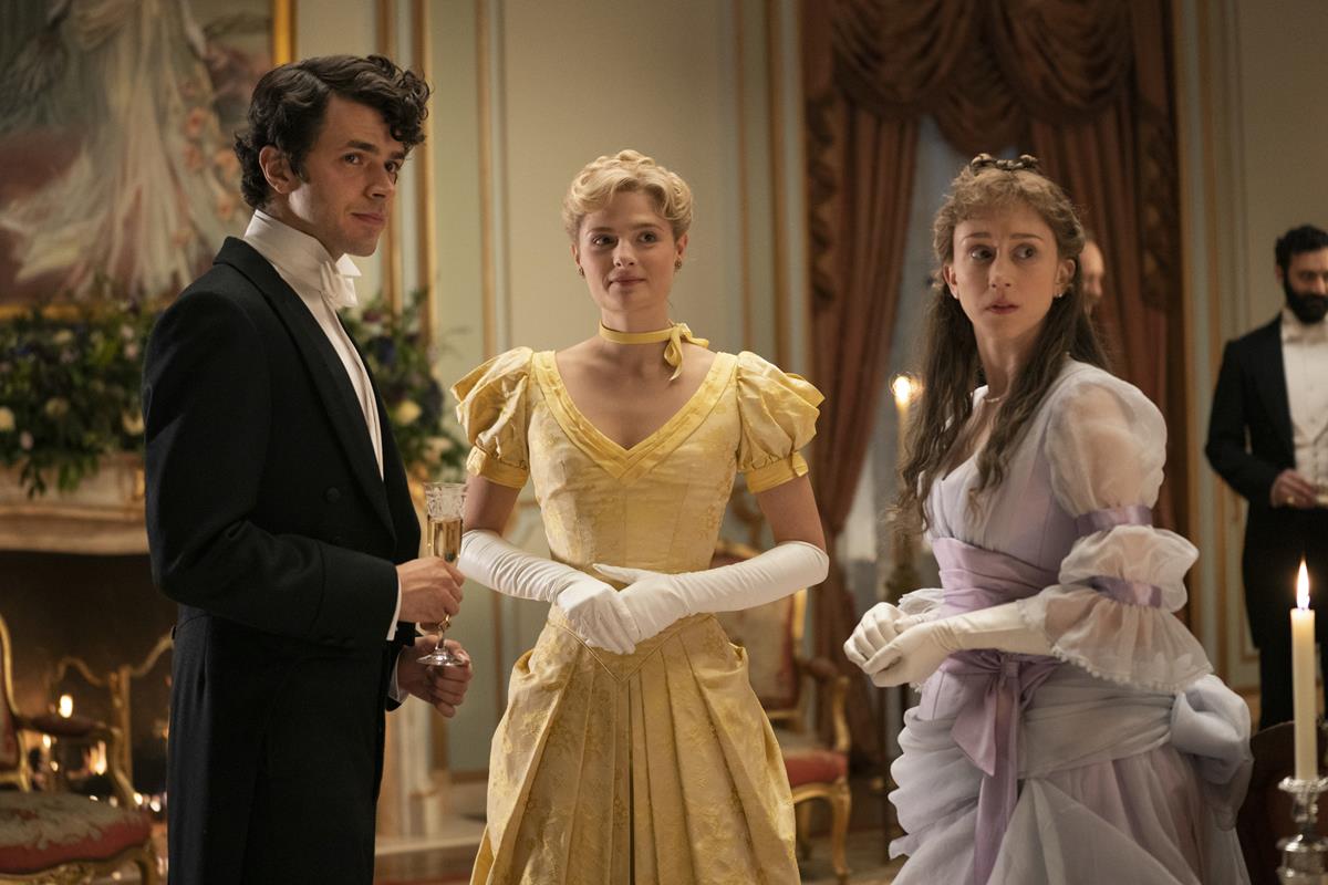Harry Richardson as Larry Russell, Louisa Jacobson as Marian Brook, and Taissa Farmiga as Gladys Russell in season 1 episode 1 of “The Gilded Age.” Cr: Warner Media
