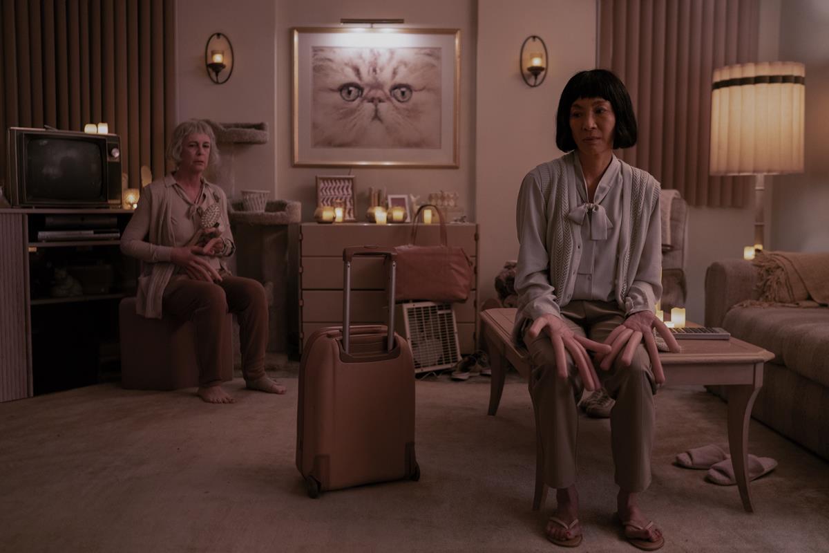 Michelle Yeoh as Evelyn Wang and Jamie Lee Curtis as Deirdre Beaubeirdra in “Everything Everywhere All At Once,” directed by Daniel Kwan and Daniel Scheinert. Cr: Allyson Riggs/A24