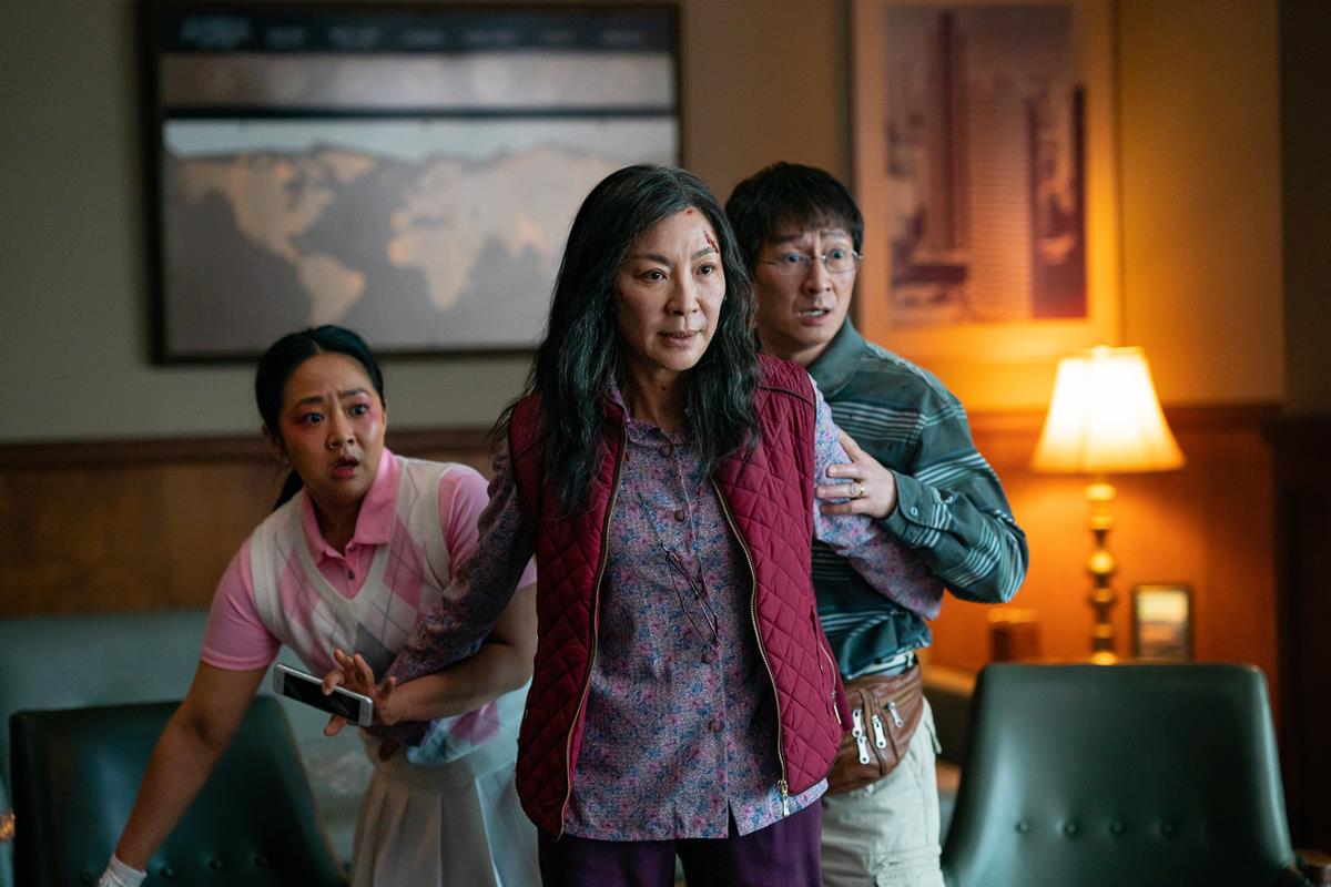 Stephanie Hsu as Joy Wang, Michelle Yeoh as Evelyn Wang, and Ke Huy Quan as Waymond Wang in “Everything Everywhere All at Once,” directed by Daniel Kwan and Daniel Scheinert. Cr: Allyson Riggs/A24