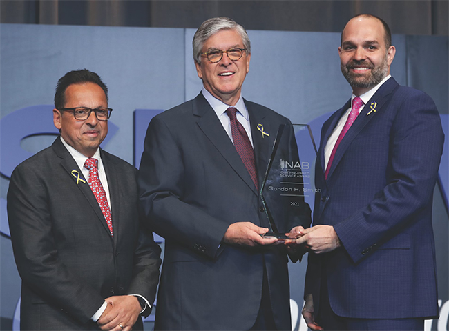 Former President and CEO Gordon Smith (center), receives the NAB Distinguished Service Award from Curtis LeGeyt (right), NAB President and CEO, and David Santrella, CEO, Salem Media Group and NAB Joint Board Chair.
