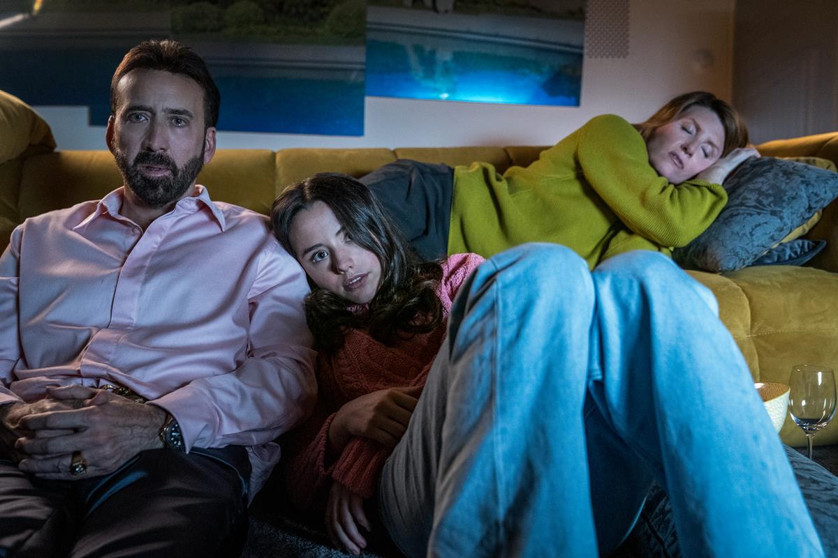 Nick Cage as himself, Lilly Sheen as Addy Cage, and Sharon Horgan as Olivia in “The Unbearable Weight of Massive Talent.” Cr: Katalin Vermes/Lionsgate
