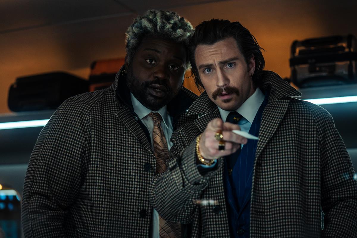 Bryan Tyree Henry as Lemon and Aaron Taylor-Johnson as Tangerine in director David Leitch’s “Bullet Train.” Cr: Scott Garfield/Sony Pictures