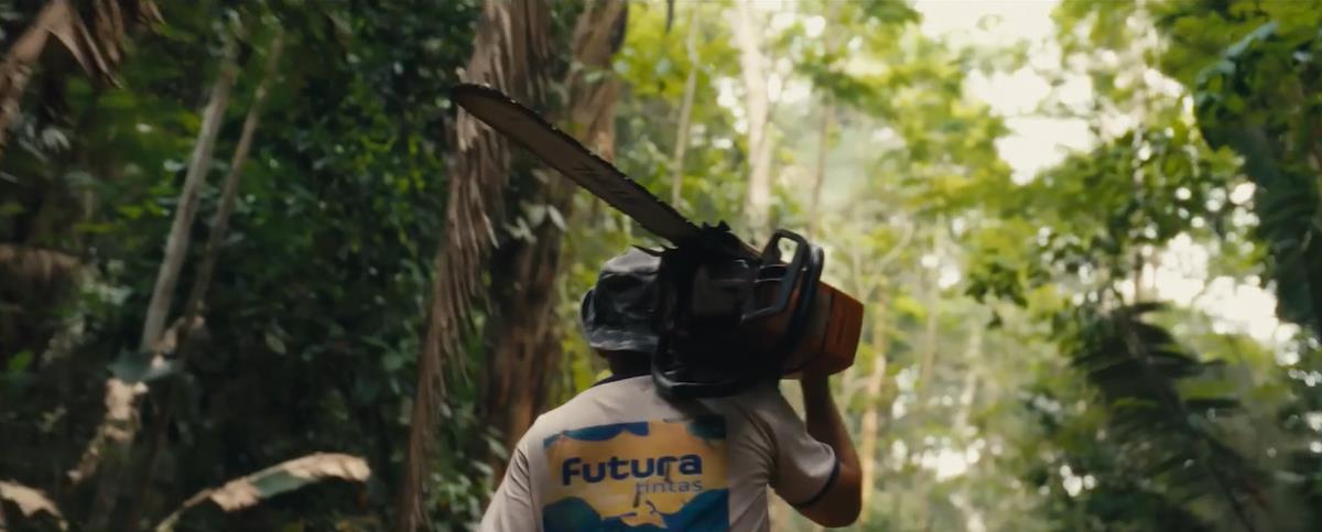 A local farmer with a chainsaw heads into the Amazon rainforest. Cr: National Geographic/Amazon Land Documentary
