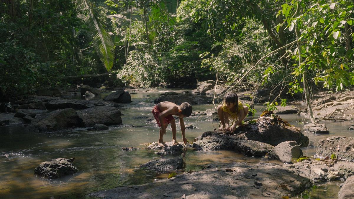 Uru-eu-wau-wau children play in a stream next to their village. Cr: Alex Pritz/Amazon Land Documentary