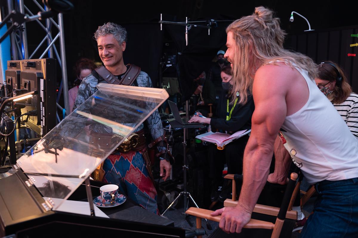 Director Taika Waititi and Chris Hemsworth on the set of “Thor: Love and Thunder.” Cr: Jasin Boland/Marvel Studios