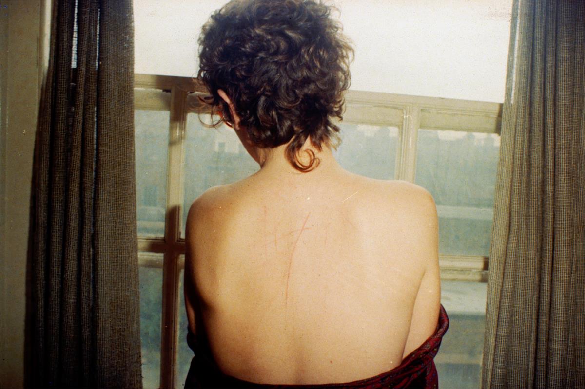 A self-portrait of Nan Goldin in “All the Beauty and the Bloodshed.” Cr: Nan Goldin/Neon