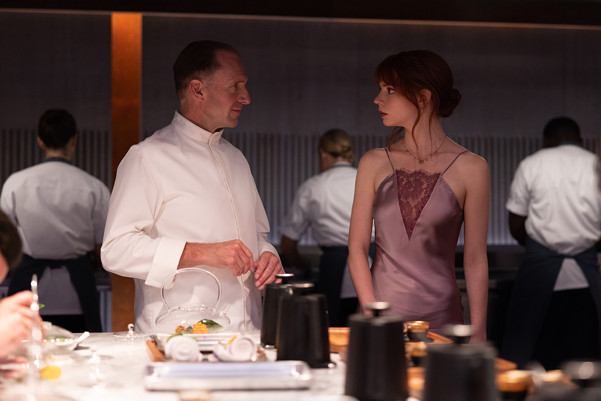 Ralph Fiennes and Anya Taylor-Joy in the film “The Menu.” Photo by Eric Zachanowich. Courtesy of Searchlight Pictures. © 2022 20th Century Studios All Rights Reserved