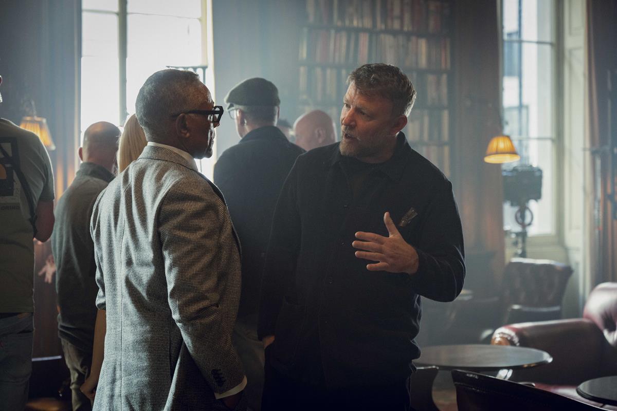 Giancarlo Esposito and Guy Ritchie behind the scenes of “The Gentlemen.” Cr: Kevin Baker/Netflix