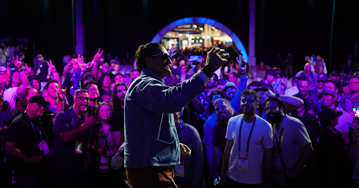 Casey Neistat takes a selfie with the crowd on the Main Stage of the 2024 NAB Show.